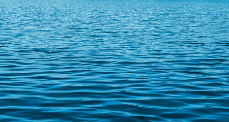 Naklejka premium Sea water surface background. Ocean ripple. The calm of nature marine. Blue aqua backdrop.
