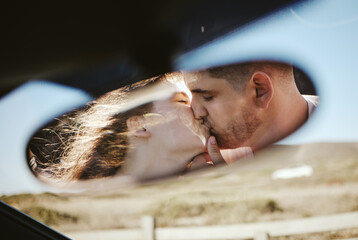Kiss, mirror and couple on a road trip for holiday during marriage together. Young man and woman...