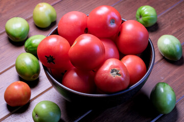 Red ripe tomatoes on a plate