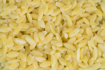 wheat pasta groats in rice shaped egg noodles