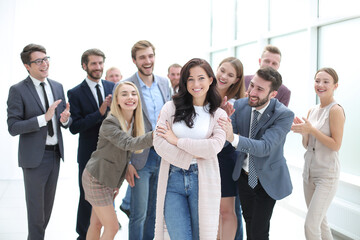 happy business team admiring their young leader