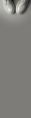 beige women's shoes on a gray background. Autumn shoes. Vertical banner for insertion into site. Place for text cope space.