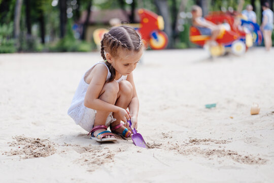 Little Girl Playing Sandbox Playground Digging Sand Shovel Building Sand Figure Summer Day