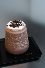 cocoa drink with chocolate and whip cream.