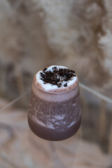 cocoa drink with chocolate and whip cream.
