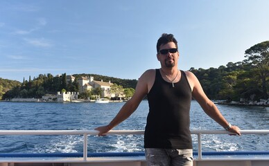 Man on the deck of a cruise ship