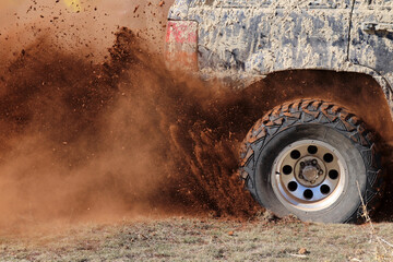 off-road racing on dusty terrain