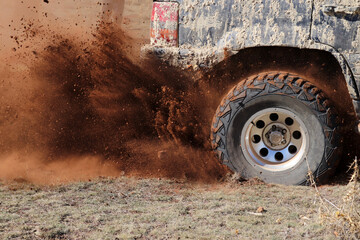 off-road racing on dusty terrain
