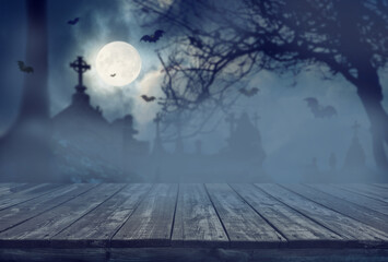 Ol wooden planks with mystery night cemetery background. Halloween background.