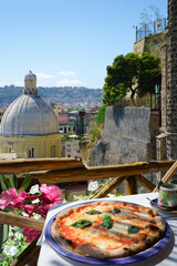 Pizzeria overlooking Naples city, Italy