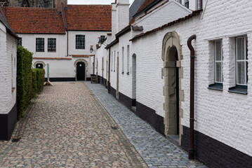 Kortrijk, West Flanders Region - Belgium -  White painted brick stone facades of the beguinage