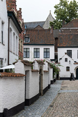 Kortrijk, West Flanders Region - Belgium - White painted brick stone facades of the beguinage