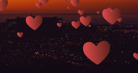 Image of hearts over night cityscape