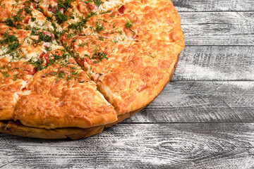 Pizza, homemade large size pizza on a wooden white background