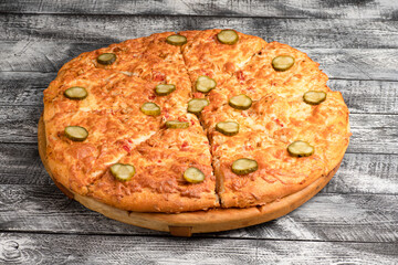Pizza, homemade large size pizza on a wooden white background