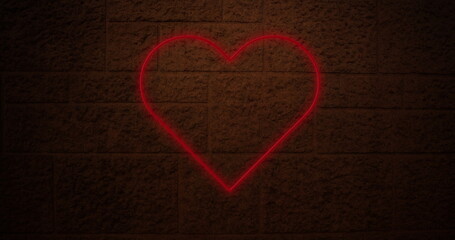 Image of neon heart over dark brick wall