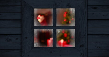 Image of window with blurred christmas tree and decorations