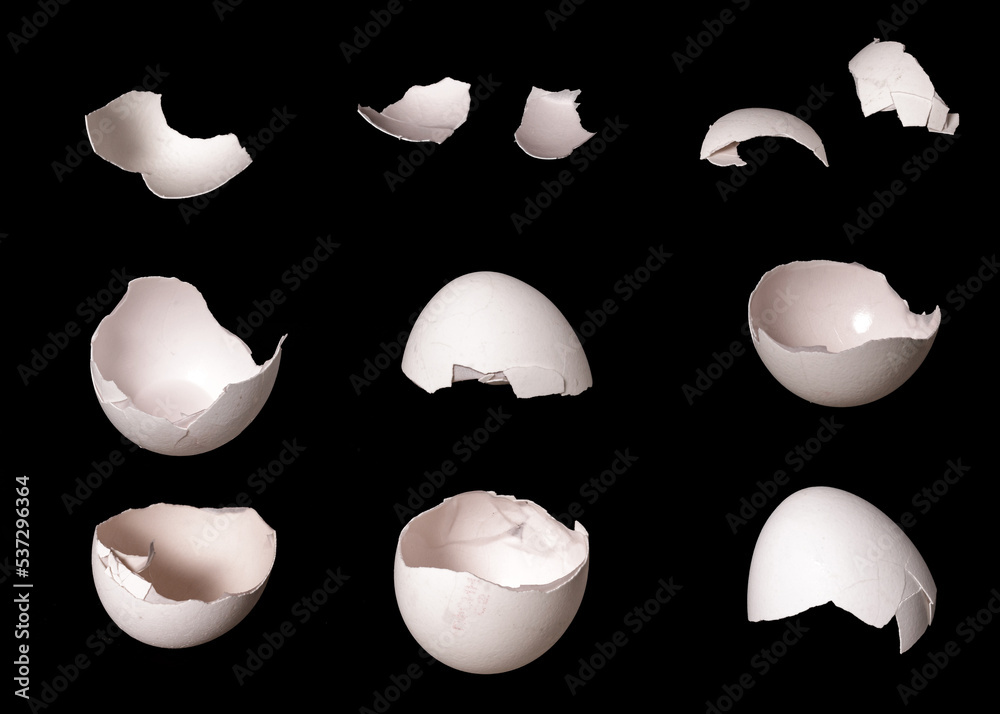 Poster set of egg parts with cracks isolated on black background