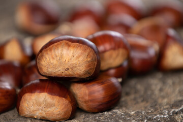natural chestnuts stacked outdoors, autumn