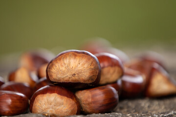 natural chestnuts stacked outdoors, autumn