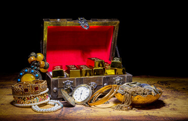 Vintage treasure hunt theme with gold bars - coins and world map in background