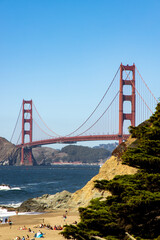 Fototapeta premium Famous Golden Gate bridge in San Francisco with a clear blue sky and wavy sea