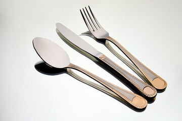 Fork, knife and spoon, kitchen cutlery on white