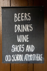 Copenhagen, Denmark A blackboard sign at a bar says: "Beers, Drinks, Wine, Shots and old school atmosphere."