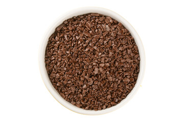 Chocolate sprinkles in white bowl top view
