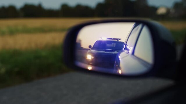Stylish Side Mirror Car Chase Shot: Highway Traffic Patrol Vehicle Pull over Suspect. Professional Female Police Officer Approaches Vehicle, Asks Driver License and Registration. Cinematic Shot