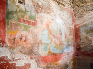 Ornately painted wall murals inside a villa in Pompeii, Italy