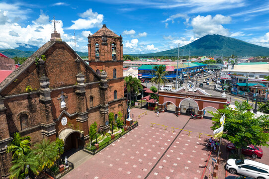 Nabua, Camarines Sur, Philippines - Nabua Church or Holy Cross Parish, with Mt. Iriga looming in the distance.