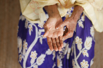 Elderly asian woman suffering from pain 