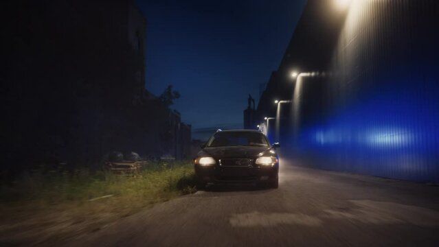 Highway Traffic Patrol Car In Pursuit of Criminal Vehicle. Police Officers in Squad Car Chase Suspect on Industrial Area Road. Criminal Crashes Boxes. Cinematic Atmospheric High Speed Action Scene