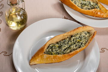 Turkish sfiha, stuffed with ricotta cheese and spinach