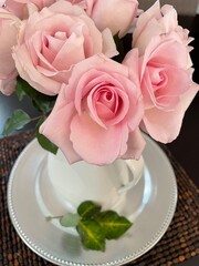 soft pink roses in vase