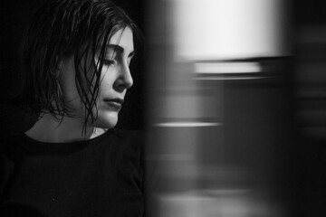 creative portrait of a young woman looking for an emotion of drama