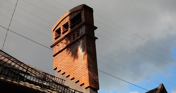 Chimney on the roof of the building. Architecture of an old European city.