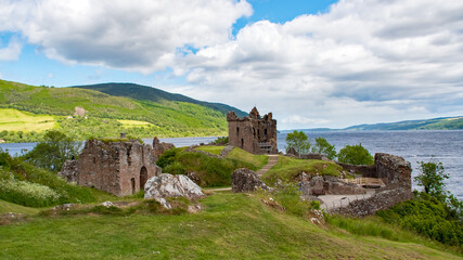 Fototapeta na wymiar Historic Castles of Scotland - mystical and mighty - witnesses of a great past Urquhart Castle is a ruined castle on Loch Ness. United Kingdom