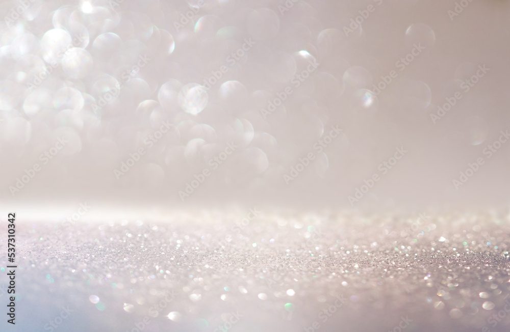 Poster beautiful festive background image with sparkles and bokeh in pastel pearl and silver colors. select