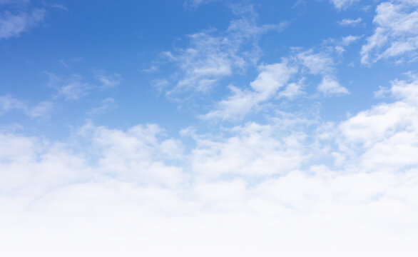 
Abstract of fleecy cloudy on blue sky with white gradient, sunlight in summer. cloudscape background ina good weather, landscape image