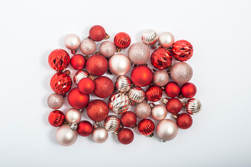 Christmas decorative balls on a white background. Top view, flat lay.