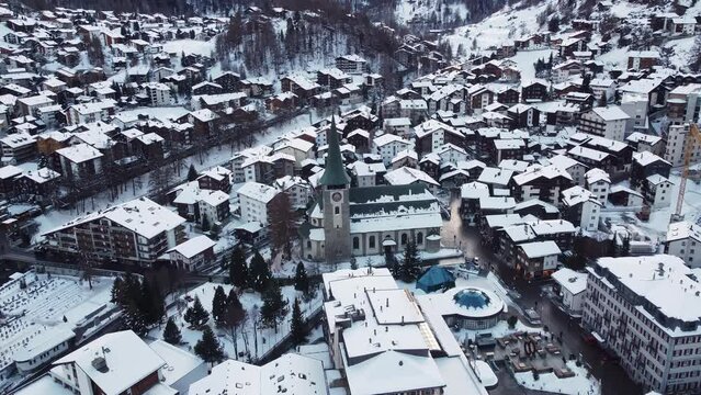 Zermatt, Switzerland: Aerial drone footage of the famous Zermatt traditional village in the Swiss alps in winter. 
