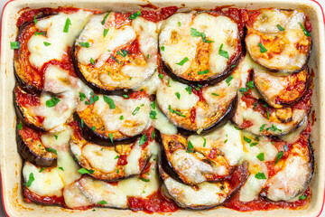 Baked eggplant with cheese mozzarella and tomatoes. Healthy eating. Italian food. Parmigiana di melanzane.