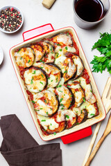Baked eggplant with cheese mozzarella and tomatoes. Healthy eating. Italian food. Parmigiana di melanzane.