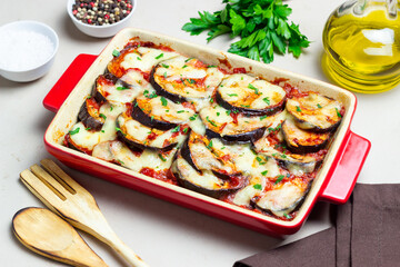 Baked eggplant with cheese mozzarella and tomatoes. Healthy eating. Italian food. Parmigiana di melanzane.