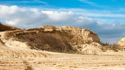 sand quarry, in the photo, a quarry for the extraction of sand against a blue sky