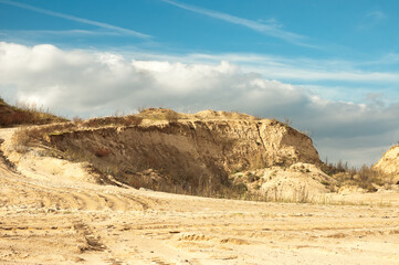 sand quarry, in the photo, a quarry for the extraction of sand against a blue sky