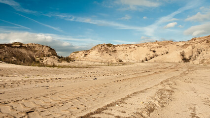 sand quarry, in the photo, a quarry for the extraction of sand against a blue sky