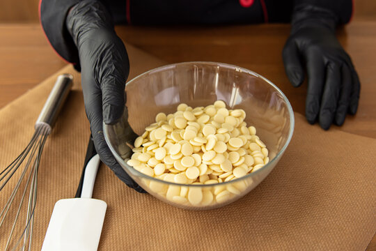 White chocolate confectionery callets. Cooking chocolate, sweets, ice cream and desserts. Professional chocolatier